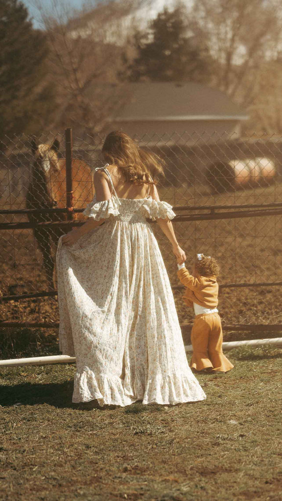 Mom and daughter photo shoot next to a horse in a Salt Gown dress 