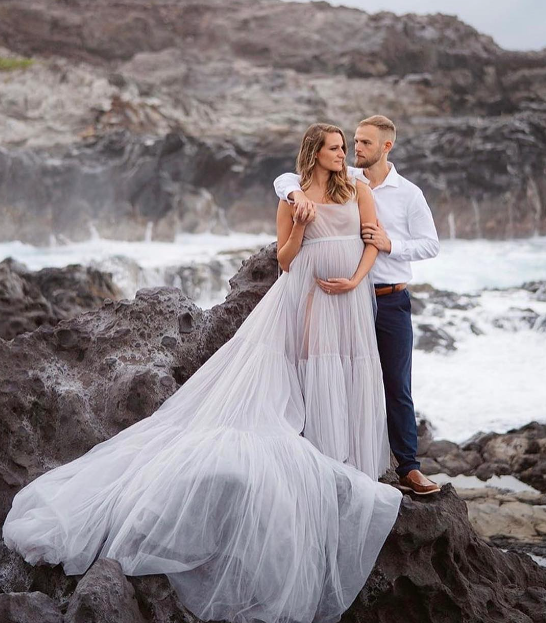 Beach maternity session in a salt gowns dress